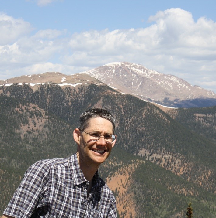 Jared Orsi in front of mountain