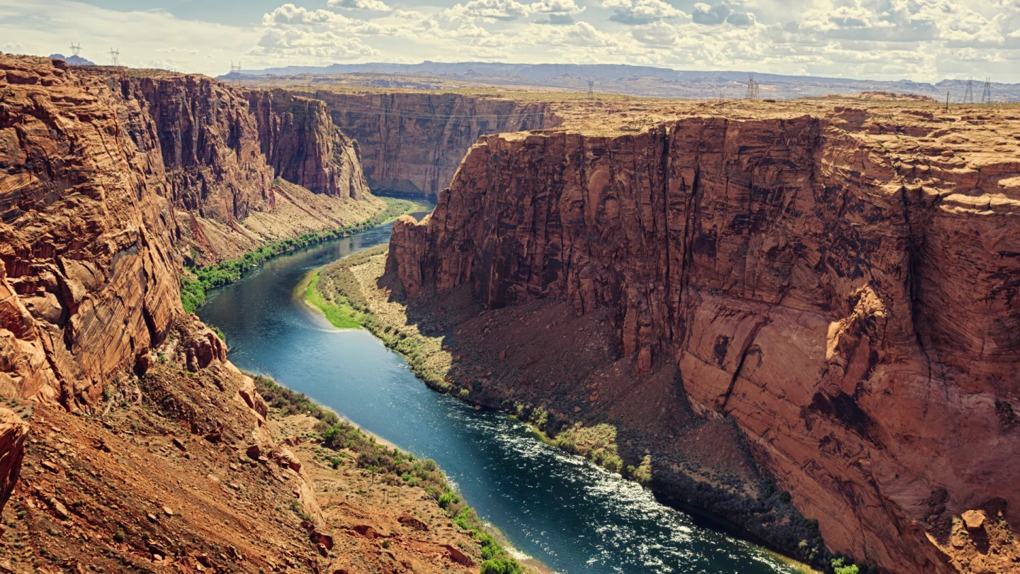River cutting through red rocks canyon