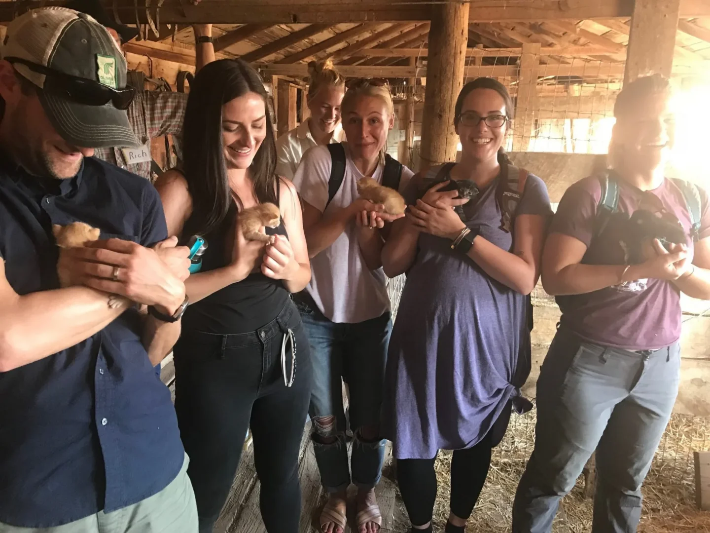 Group of graduate students holding kittens